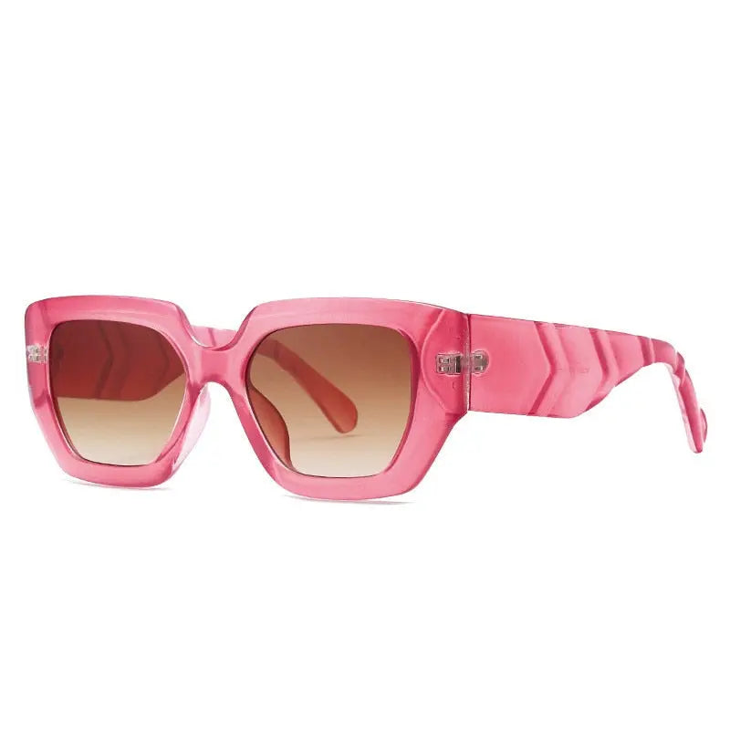 a pair of pink sunglasses on a white background.